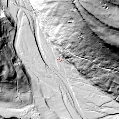 Shaded relief map of the ground around DL116QN, computed from Environment Agency LiDAR. The ground here sits at about 242 m above sea level and falls 201 m across the surrounding 800 m. Surface water reaching this point runs off ground lying to the north-north-east, 181.9 m higher.