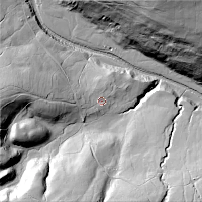 Shaded relief map of the ground around DL116RB, computed from Environment Agency LiDAR. The ground here sits at about 268 m above sea level and falls 84 m across the surrounding 800 m. Surface water reaching this point runs off ground lying to the west, 9.7 m higher.