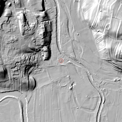 Shaded relief map of the ground around DL116TR, computed from Environment Agency LiDAR. The ground here sits at about 184 m above sea level and falls 54 m across the surrounding 800 m. Surface water reaching this point runs off ground lying to the north-west, 19.2 m higher.