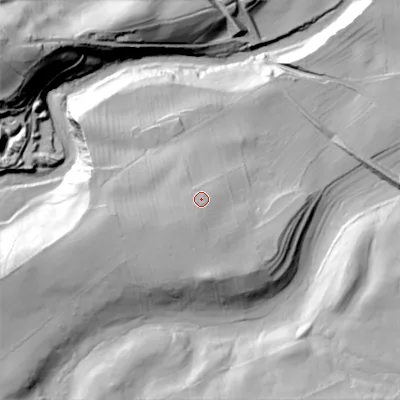 Shaded relief map of the ground around DL120PN, computed from Environment Agency LiDAR. The ground here sits at about 257 m above sea level and falls 57 m across the surrounding 800 m. Surface water reaching this point runs off ground lying to the south-west, 6.0 m higher.
