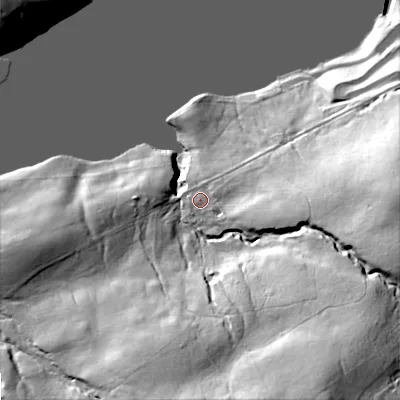 Shaded relief map of the ground around DL120PW, computed from Environment Agency LiDAR. The ground here sits at about 289 m above sea level and falls 69 m across the surrounding 800 m. Surface water reaching this point runs off ground lying to the east-south-east, 21.7 m higher.