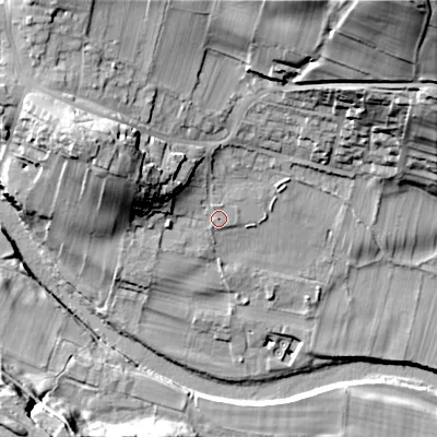 Shaded relief map of the ground around DL120TN, computed from Environment Agency LiDAR. The ground here sits at about 218 m above sea level and falls 56 m across the surrounding 800 m. Surface water reaching this point runs off ground lying to the north-west, 9.1 m higher.