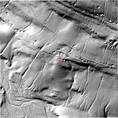 Shaded relief map of the ground around DL120XU, computed from Environment Agency LiDAR. The ground here sits at about 443 m above sea level and falls 127 m across the surrounding 800 m. Surface water reaching this point runs off ground lying to the north-north-east, 24.8 m higher.
