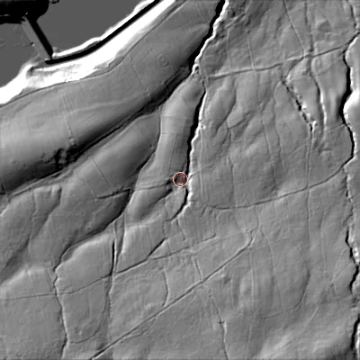 Shaded relief map of the ground around DL129UP, computed from Environment Agency LiDAR. The ground here sits at about 290 m above sea level and falls 63 m across the surrounding 800 m. Surface water reaching this point runs off ground lying to the south-south-east, 33.6 m higher.