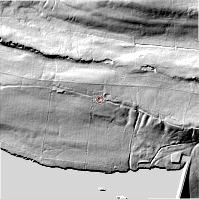 Shaded relief map of the ground around DL129UX, computed from Environment Agency LiDAR. The ground here sits at about 360 m above sea level and falls 67 m across the surrounding 800 m. Surface water reaching this point runs off ground lying to the north-west, 7.0 m higher.