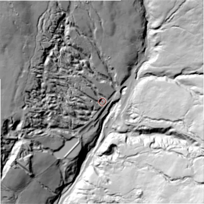 Shaded relief map of the ground around DL131AA, computed from Environment Agency LiDAR. The ground here sits at about 409 m above sea level and falls 112 m across the surrounding 800 m. Surface water reaching this point runs off ground lying to the north-west, 79.2 m higher.
