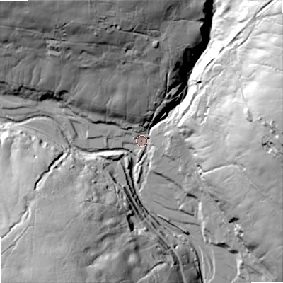 Shaded relief map of the ground around DL132BG, computed from Environment Agency LiDAR. The ground here sits at about 325 m above sea level and falls 80 m across the surrounding 800 m. Surface water reaching this point runs off ground lying to the east-north-east, 70.2 m higher.
