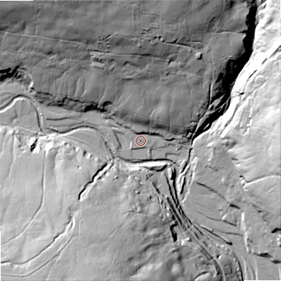 Shaded relief map of the ground around DL132DA, computed from Environment Agency LiDAR. The ground here sits at about 327 m above sea level and falls 78 m across the surrounding 800 m. Surface water reaching this point runs off ground lying to the north, 56.5 m higher.