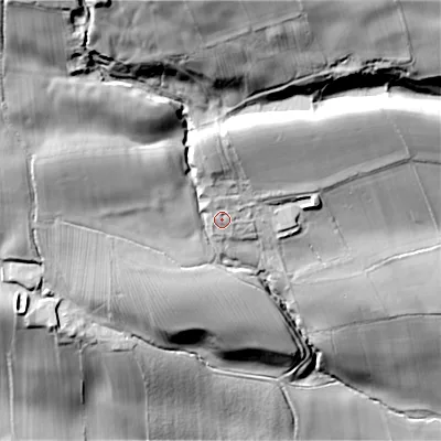 Shaded relief map of the ground around DL132SH, computed from Environment Agency LiDAR. The ground here sits at about 222 m above sea level and falls 101 m across the surrounding 800 m. Surface water reaching this point runs off ground lying to the north-north-west, 7.3 m higher.