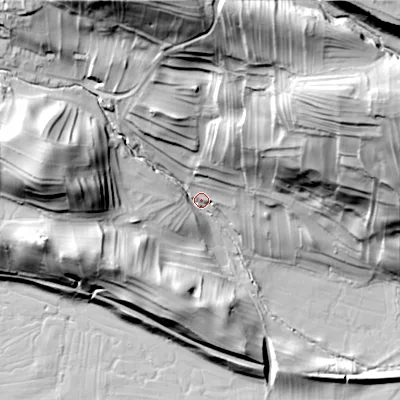 Shaded relief map of the ground around DL83JE, computed from Environment Agency LiDAR. The ground here sits at about 208 m above sea level and falls 67 m across the surrounding 800 m. Surface water reaching this point runs off ground lying to the north, 57.9 m higher.