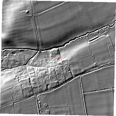 Shaded relief map of the ground around DN214AT, computed from Environment Agency LiDAR. The ground here sits at about 12 m above sea level and falls 15 m across the surrounding 800 m. Surface water reaching this point runs off ground lying to the south, 5.0 m higher.