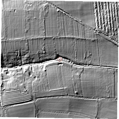 Shaded relief map of the ground around DN220BU, computed from Environment Agency LiDAR. The ground here sits at about 12 m above sea level and falls 16 m across the surrounding 800 m. Surface water reaching this point runs off ground lying to the west-south-west, 11.5 m higher.