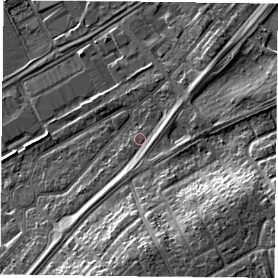 Shaded relief map of the ground around DN24QH, computed from Environment Agency LiDAR. The ground here sits at about 12 m above sea level and falls 14 m across the surrounding 800 m. Surface water reaching this point runs off ground lying to the south, 2.1 m higher.