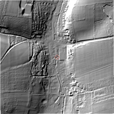 Shaded relief map of the ground around DT110JX, computed from Environment Agency LiDAR. The ground here sits at about 69 m above sea level and falls 33 m across the surrounding 800 m. Surface water reaching this point runs off ground lying to the north-west, 31.3 m higher.
