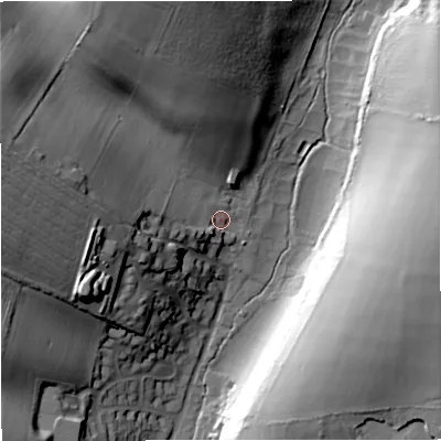 Shaded relief map of the ground around DT110LA, computed from Environment Agency LiDAR. The ground here sits at about 77 m above sea level and falls 38 m across the surrounding 800 m. Surface water reaching this point runs off ground lying to the west-north-west, 32.7 m higher.