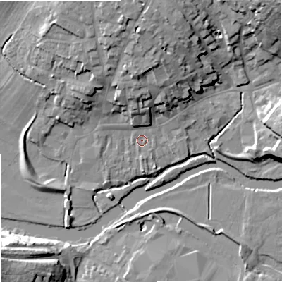 Shaded relief map of the ground around DT117DJ, computed from Environment Agency LiDAR. The ground here sits at about 33 m above sea level and falls 23 m across the surrounding 800 m. Surface water reaching this point runs off ground lying to the north, 8.8 m higher.