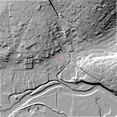 Shaded relief map of the ground around DT117DU, computed from Environment Agency LiDAR. The ground here sits at about 33 m above sea level and falls 28 m across the surrounding 800 m. Surface water reaching this point runs off ground lying to the north-west, 13.8 m higher.