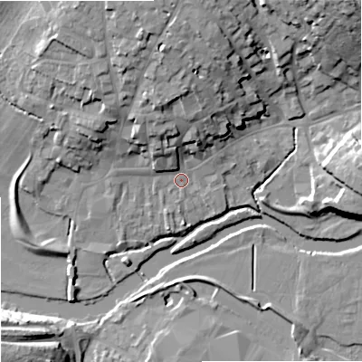 Shaded relief map of the ground around DT117DX, computed from Environment Agency LiDAR. The ground here sits at about 33 m above sea level and falls 21 m across the surrounding 800 m. Surface water reaching this point runs off ground lying to the north, 14.2 m higher.