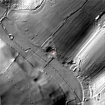 Shaded relief map of the ground around DT118JG, computed from Environment Agency LiDAR. The ground here sits at about 69 m above sea level and falls 31 m across the surrounding 800 m. Surface water reaching this point runs off ground lying to the north-north-east, 12.3 m higher.