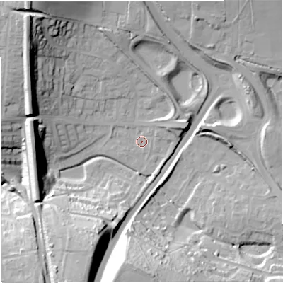 Shaded relief map of the ground around DT35QT, computed from Environment Agency LiDAR. The ground here sits at about 21 m above sea level and falls 37 m across the surrounding 800 m. Surface water reaching this point runs off ground lying to the south, 33.6 m higher.