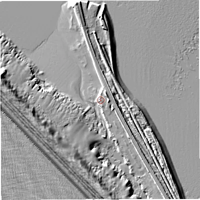 Shaded relief map of the ground around DT49XE, computed from Environment Agency LiDAR. The ground here sits at about 2 m above sea level and falls 13 m across the surrounding 800 m. Surface water reaching this point runs off ground lying to the east, 1.7 m higher.