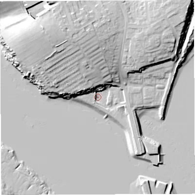 Shaded relief map of the ground around DT49YU, computed from Environment Agency LiDAR. The ground here sits at about 2 m above sea level and falls 23 m across the surrounding 800 m. Surface water reaching this point runs off ground lying to the north-north-west, 15.0 m higher.