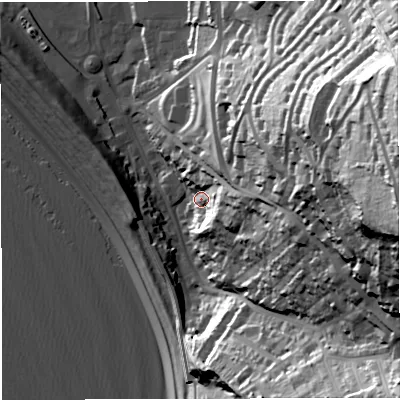 Shaded relief map of the ground around DT51AT, computed from Environment Agency LiDAR. The ground here sits at about 12 m above sea level and falls 88 m across the surrounding 800 m. Surface water reaching this point runs off ground lying to the east, 31.5 m higher.