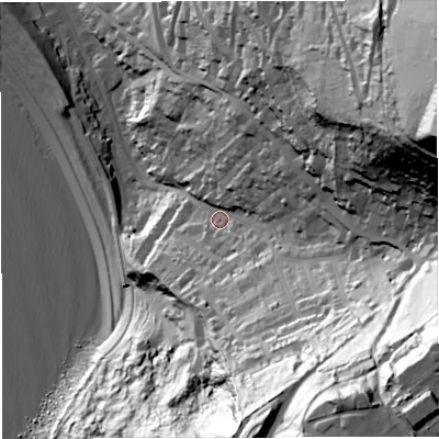 Shaded relief map of the ground around DT51JH, computed from Environment Agency LiDAR. The ground here sits at about 26 m above sea level and falls 129 m across the surrounding 800 m. Surface water reaching this point runs off ground lying to the east-north-east, 103.6 m higher.