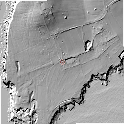 Shaded relief map of the ground around DT52JT, computed from Environment Agency LiDAR. The ground here sits at about 18 m above sea level and falls 53 m across the surrounding 800 m. Surface water reaching this point runs off ground lying to the north-north-west, 29.6 m higher.