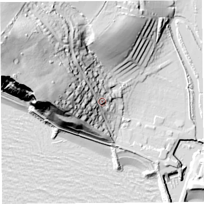 Shaded relief map of the ground around DT64HR, computed from Environment Agency LiDAR. The ground here sits at about 14 m above sea level and falls 64 m across the surrounding 800 m. Surface water reaching this point runs off ground lying to the west, 40.7 m higher.