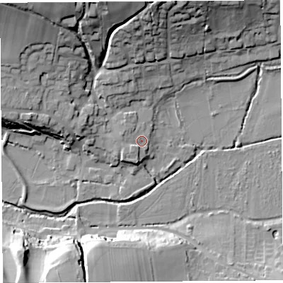 Shaded relief map of the ground around DT64QS, computed from Environment Agency LiDAR. The ground here sits at about 9 m above sea level and falls 29 m across the surrounding 800 m. Surface water reaching this point runs off ground lying to the south-west, 3.4 m higher.