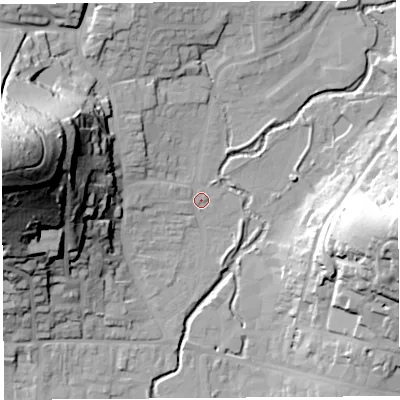 Shaded relief map of the ground around DT65DP, computed from Environment Agency LiDAR. The ground here sits at about 9 m above sea level and falls 74 m across the surrounding 800 m. Surface water reaching this point runs off ground lying to the west-north-west, 70.7 m higher.