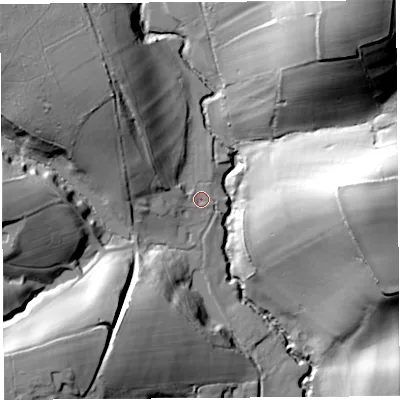 Shaded relief map of the ground around DT65LJ, computed from Environment Agency LiDAR. The ground here sits at about 33 m above sea level and falls 63 m across the surrounding 800 m. Surface water reaching this point runs off ground lying to the west-north-west, 15.1 m higher.