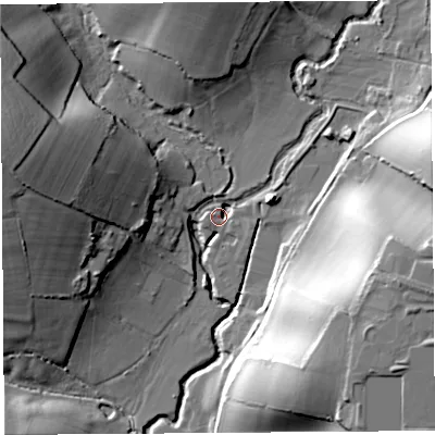 Shaded relief map of the ground around DT65PL, computed from Environment Agency LiDAR. The ground here sits at about 15 m above sea level and falls 36 m across the surrounding 800 m. Surface water reaching this point runs off ground lying to the east-south-east, 33.9 m higher.