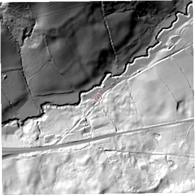 Shaded relief map of the ground around DT66RE, computed from Environment Agency LiDAR. The ground here sits at about 13 m above sea level and falls 94 m across the surrounding 800 m. Surface water reaching this point runs off ground lying to the south-east, 42.3 m higher.