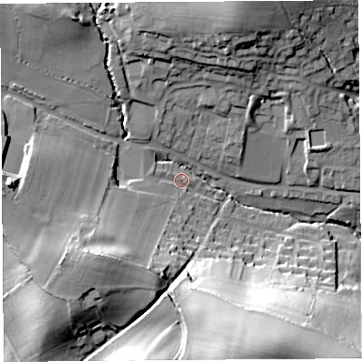 Shaded relief map of the ground around DT83DJ, computed from Environment Agency LiDAR. The ground here sits at about 69 m above sea level and falls 52 m across the surrounding 800 m. Surface water reaching this point runs off ground lying to the south-west, 21.9 m higher.