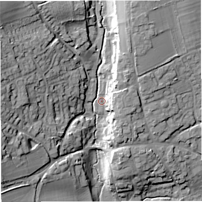 Shaded relief map of the ground around DT95FF, computed from Environment Agency LiDAR. The ground here sits at about 77 m above sea level and falls 29 m across the surrounding 800 m. Surface water reaching this point runs off ground lying to the west, 24.4 m higher.
