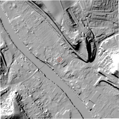 Shaded relief map of the ground around DY121AE, computed from Environment Agency LiDAR. The ground here sits at about 24 m above sea level and falls 43 m across the surrounding 800 m. Surface water reaching this point runs off ground lying to the north-north-east, 0.7 m higher.