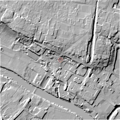 Shaded relief map of the ground around DY138XD, computed from Environment Agency LiDAR. The ground here sits at about 25 m above sea level and falls 18 m across the surrounding 800 m. Surface water reaching this point runs off ground lying to the north-north-west, 6.6 m higher.