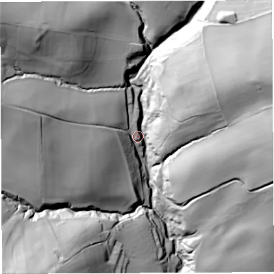 Shaded relief map of the ground around DY140DJ, computed from Environment Agency LiDAR. The ground here sits at about 135 m above sea level and falls 64 m across the surrounding 800 m. Surface water reaching this point runs off ground lying to the east-north-east, 56.8 m higher.