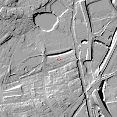 Shaded relief map of the ground around DY40FE, computed from Environment Agency LiDAR. The ground here sits at about 126 m above sea level and falls 18 m across the surrounding 800 m. Surface water reaching this point runs off ground lying to the east-north-east, 5.1 m higher.