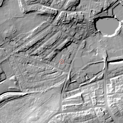 Shaded relief map of the ground around DY40JT, computed from Environment Agency LiDAR. The ground here sits at about 127 m above sea level and falls 17 m across the surrounding 800 m. Surface water reaching this point runs off ground lying to the north-west, 2.7 m higher.