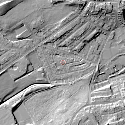 Shaded relief map of the ground around DY40JX, computed from Environment Agency LiDAR. The ground here sits at about 127 m above sea level and falls 17 m across the surrounding 800 m. Surface water reaching this point runs off ground lying to the north-west, 11.8 m higher.