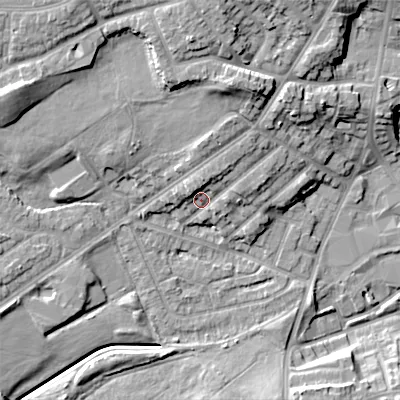 Shaded relief map of the ground around DY40LG, computed from Environment Agency LiDAR. The ground here sits at about 129 m above sea level and falls 17 m across the surrounding 800 m. Surface water reaching this point runs off ground lying to the north, 4.7 m higher.