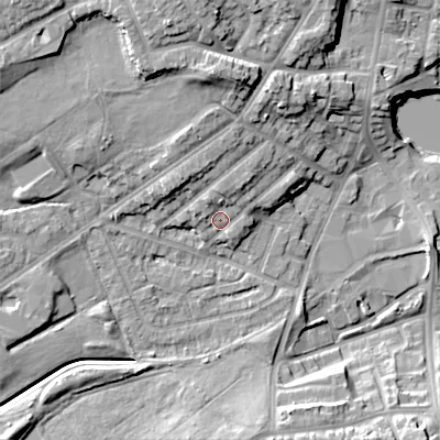 Shaded relief map of the ground around DY40LJ, computed from Environment Agency LiDAR. The ground here sits at about 129 m above sea level and falls 17 m across the surrounding 800 m. Surface water reaching this point runs off ground lying to the north-east, 3.7 m higher.