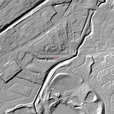 Shaded relief map of the ground around DY47JA, computed from Environment Agency LiDAR. The ground here sits at about 127 m above sea level and falls 17 m across the surrounding 800 m. Surface water reaching this point runs off ground lying to the west, 5.1 m higher.