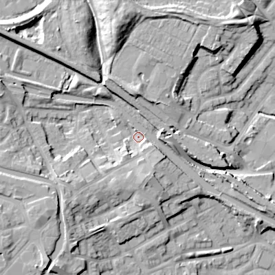 Shaded relief map of the ground around DY49BP, computed from Environment Agency LiDAR. The ground here sits at about 138 m above sea level and falls 18 m across the surrounding 800 m. Surface water reaching this point runs off ground lying to the south, 6.7 m higher.