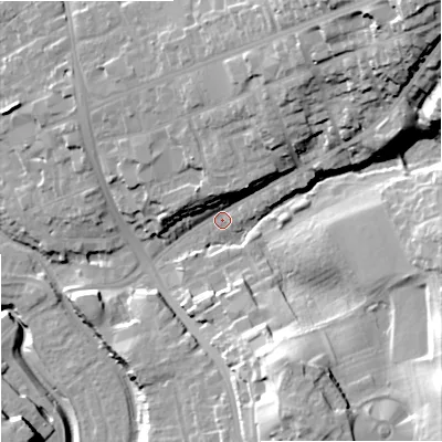 Shaded relief map of the ground around DY84EA, computed from Environment Agency LiDAR. The ground here sits at about 69 m above sea level and falls 44 m across the surrounding 800 m. Surface water reaching this point runs off ground lying to the north-east, 34.2 m higher.