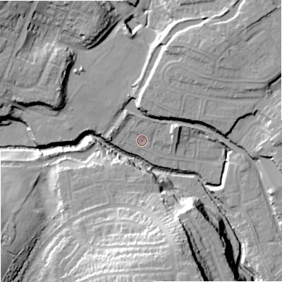 Shaded relief map of the ground around DY84XQ, computed from Environment Agency LiDAR. The ground here sits at about 63 m above sea level and falls 36 m across the surrounding 800 m. Surface water reaching this point runs off ground lying to the north, 2.2 m higher.