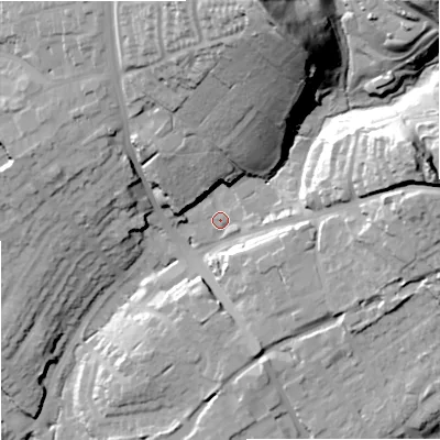 Shaded relief map of the ground around DY85TD, computed from Environment Agency LiDAR. The ground here sits at about 69 m above sea level and falls 58 m across the surrounding 800 m. Surface water reaching this point runs off ground lying to the east, 7.1 m higher.